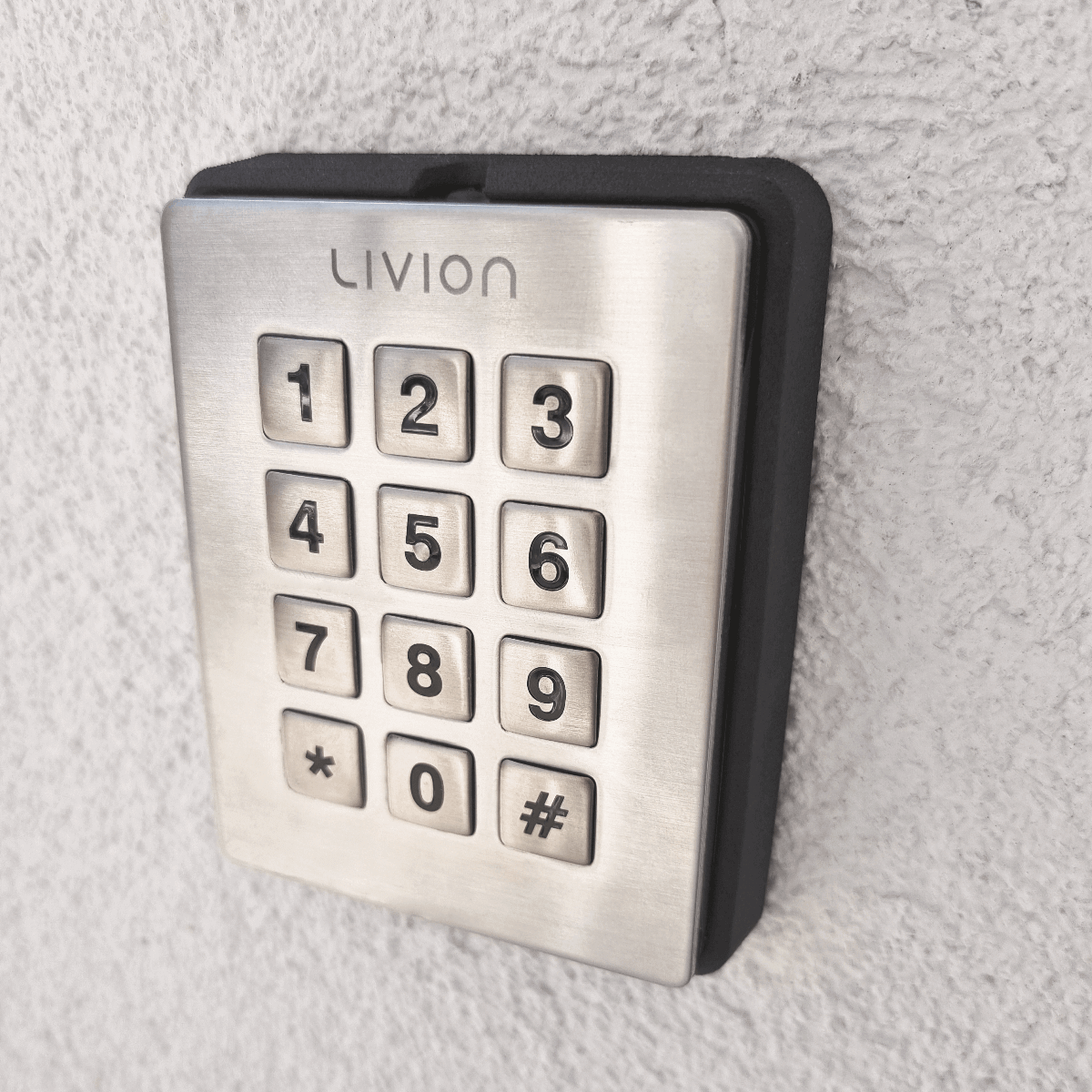 Livion Zahlencode-Tastatur für Zugangskontrolle an der Wand montiert Montierte Edelstahl-Tastatur von Livion mit Zahlencodes für Zugangskontrollen an einer Wand
